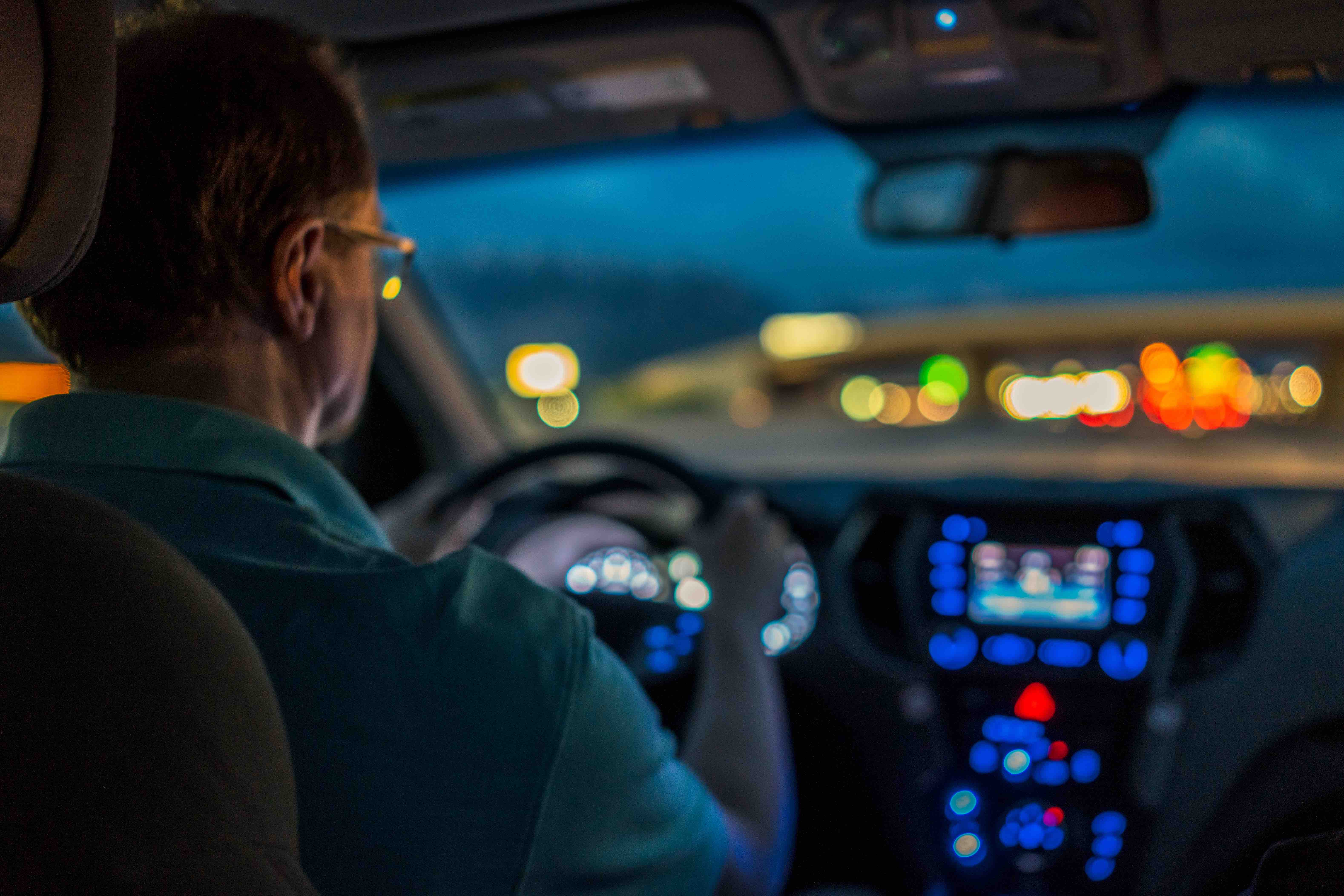 person car man sitting looking child boy holding young blue little playing orange teeth wearing game traffic phone standing ball